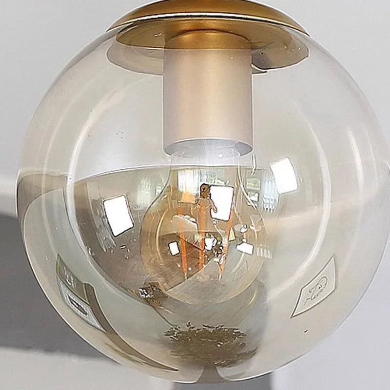 Aurelle Glass Globe Ceiling Light Mount Minimalist Design With Clear Globe And Sleek Metal Holder For Modern Interiors